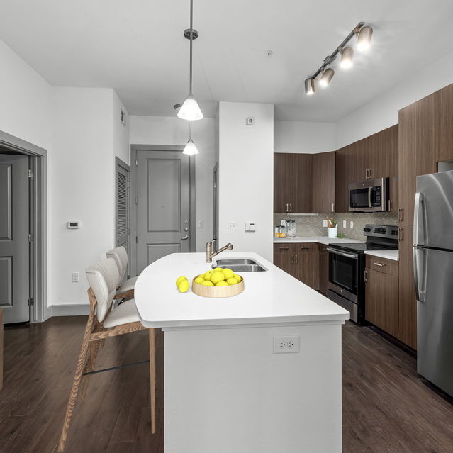Creekside at Crabtree - Apartment Kitchen with Tall Chairs by the Island