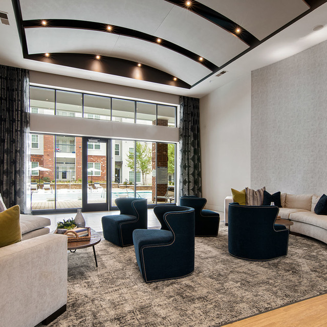 Creekside at Crabtree -  Carpeted Clubhouse Lounge by the Entrance